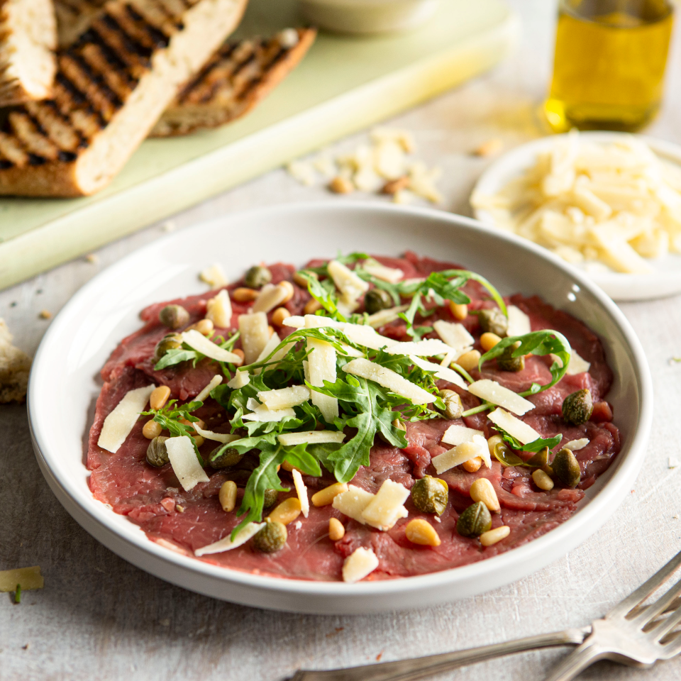 Carpaccio met rucola